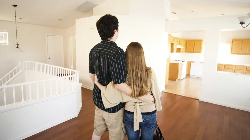 A Filipino couple choosing the right home loan for their new home